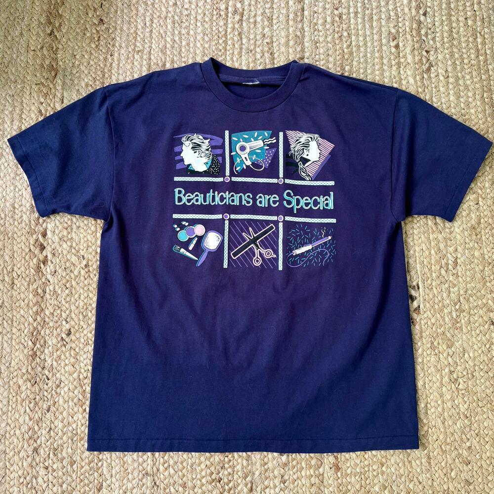 Vintage 90s navy blue T-shirt with beautician graphics